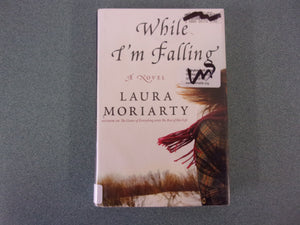 While I'm Falling, by Laura Moriarty (Ex-Library HC/DJ)