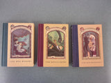 The Trouble Begins: A Box of Unfortunate Events, Books 1-3 (The Bad Beginning, The Reptile Room, The Wide Window) by Lemony Snicket (HC)